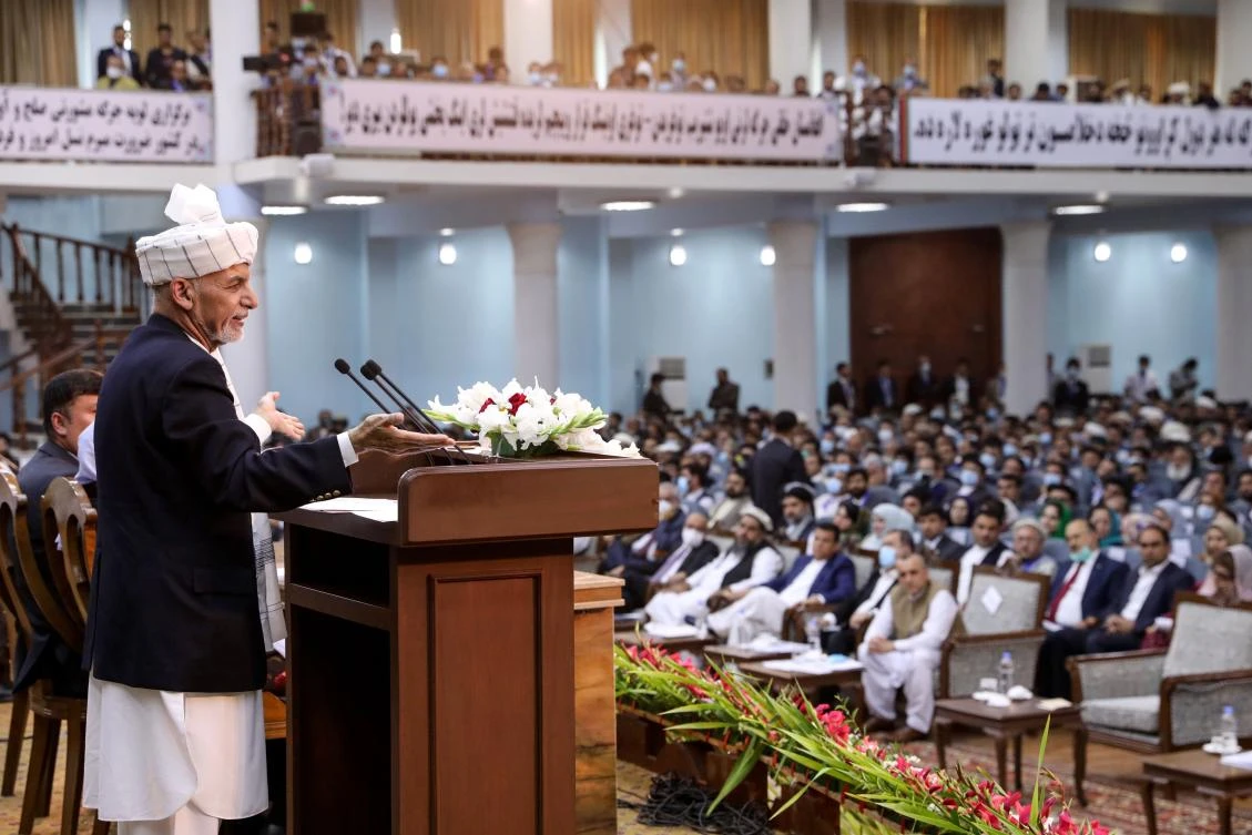 Afghan President Ashraf Ghani, left, addresses the Loya Jirga, a grand assembly of Afghan elders, which agreed to release about 400 Taliban prisoners. (Press Office of President of Afghanistan/AFP)