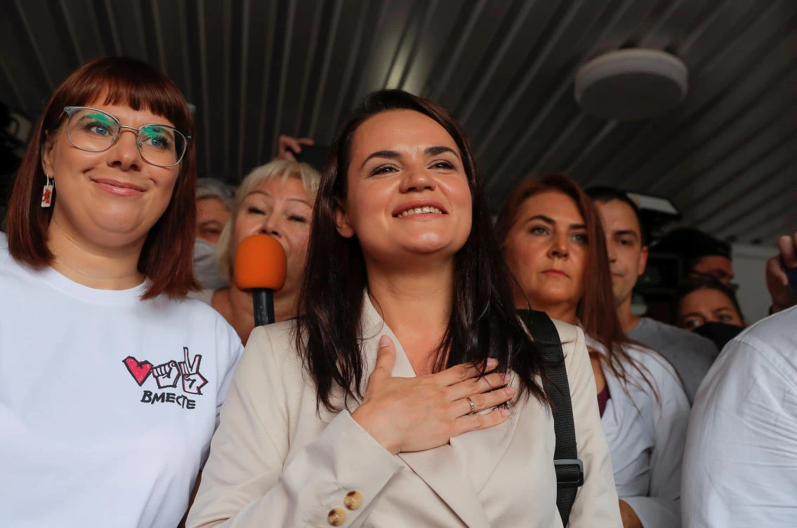 Belarusian united opposition candidate Svetlana Tikhanouskaya greets supporters as she visits a polling station during the presidential election in Minsk, Belarus, August 9, 2020. (Reuters)
