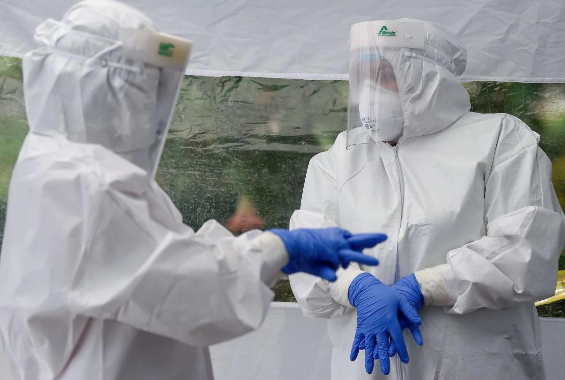 Health staffers of the city government get ready to carry out Covid-19 testing at a park in the Doctores neighborhood in Mexico City on August 11, 2020. (AFP)