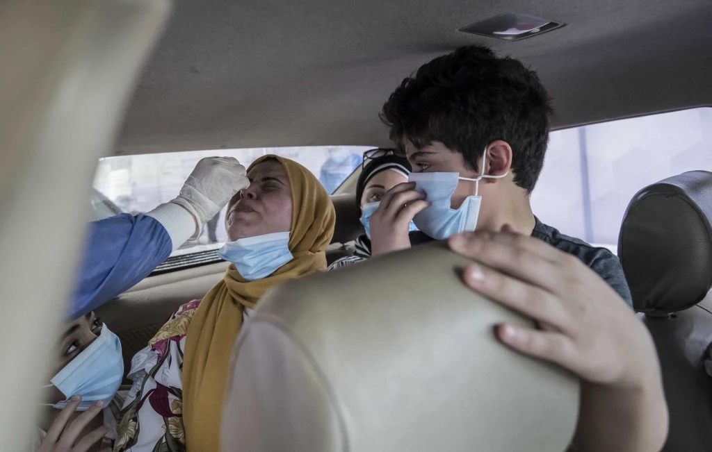 Egyptians get tested for Covid-19 at a drive-through coronavirus-testing centre at the Ain Shams University in Cairo on June 29, 2020. (File/AFP)