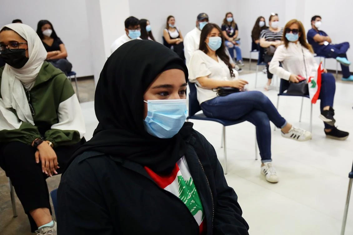 Kuwaiti and Lebanese people, masked due to COVID-19, wait to donate blood for victims of the Beirut explosion at Kuwait Central Blood Bank, August 9, 2020. (AFP)
