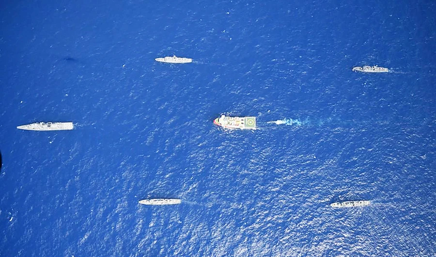 This handout photograph released by the Turkish Defence Ministry on August 12, 2020, shows Turkish seismic research vessel 'Oruc Reis' (C) as it is escorted by Turkish Naval ships in the Mediterranean Sea, off Antalya on August 10, 2020. (AFP)