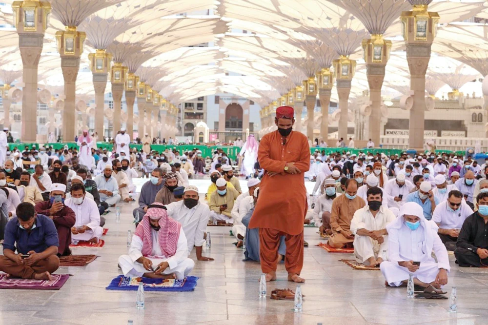 Worshippers observe physical distancing while praying at the Prophet's Mosque in Madinah on Friday. (SPA)