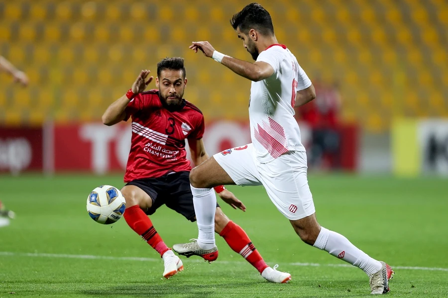 Kuwait's forward Faisal Zayid (R) dribbles past Wathba's defender Jaber Khatab during the AFC Cup group B football match between Syria's Al-Wathba and Kuwait's Kuwait SC at Zabeel Stadium in Dubai on February 24, 2020. (File/AFP)DUBAI: Kuwait’s football league will resume on Saturday after its suspension since March due to the coronavirus outbreak, state news agency KUNA reported. The first match will be between Kuwait Sports club and Al-Naser Sport Club.