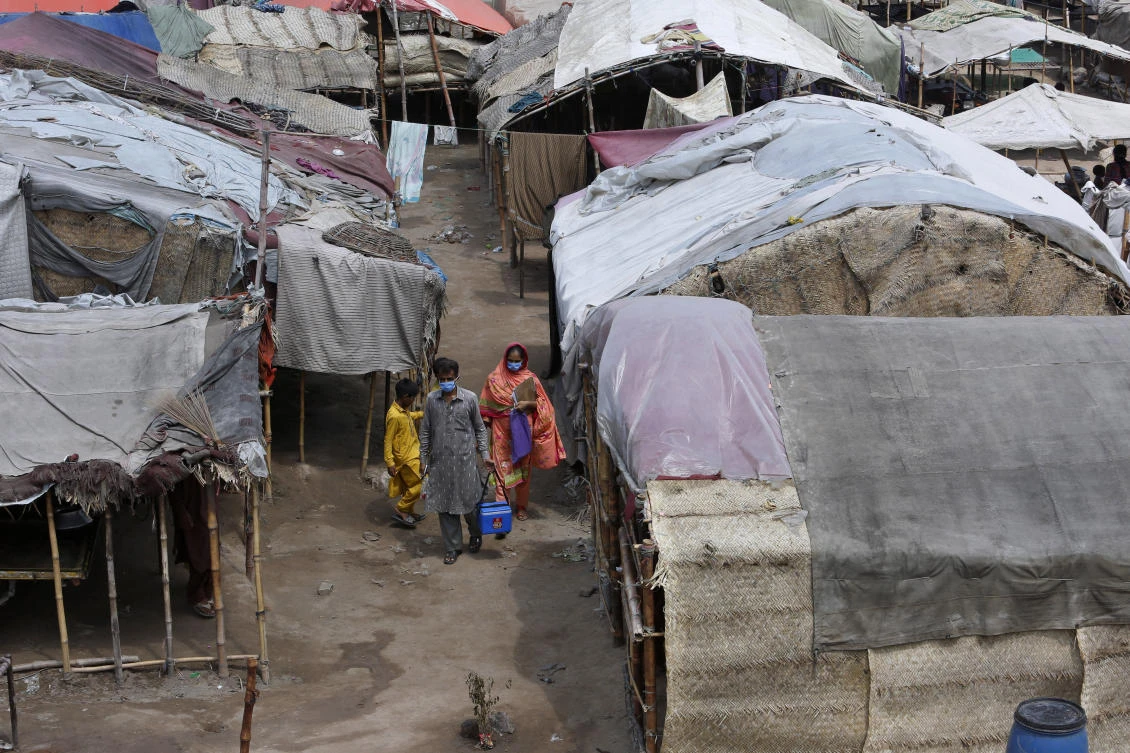 Health workers visit a slum area for polio vaccination, in Lahore, Pakistan, Saturday, Aug. 15, 2020. (AP)