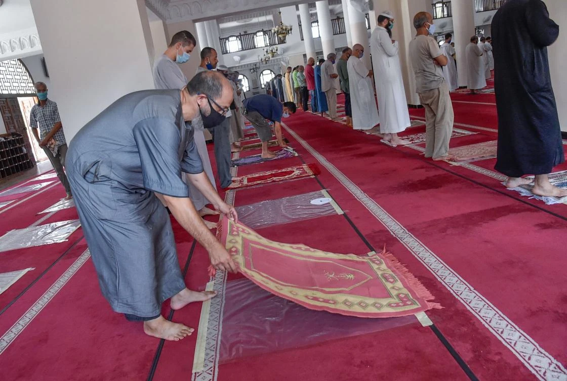 Algerian men perform the noon prayer at the El Fateh mosque in the El Afia de Kouba neighbourhood of the capital Algiers, on August 15, 2020, as the country eases COVID-19 restrictions. (AFP)