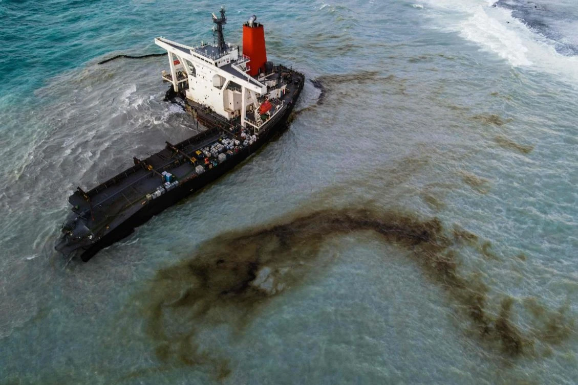 This aerial picture taken on August 16, 2020, shows the MV Wakashio bulk carrier that had run aground and broke into two parts near Blue Bay Marine Park, Mauritius. A ship that has leaked more than 1,000 tons of oil in pristine waters off the Mauritius coast has split into two, its Japanese operator said August 16, 2020. (AFP)