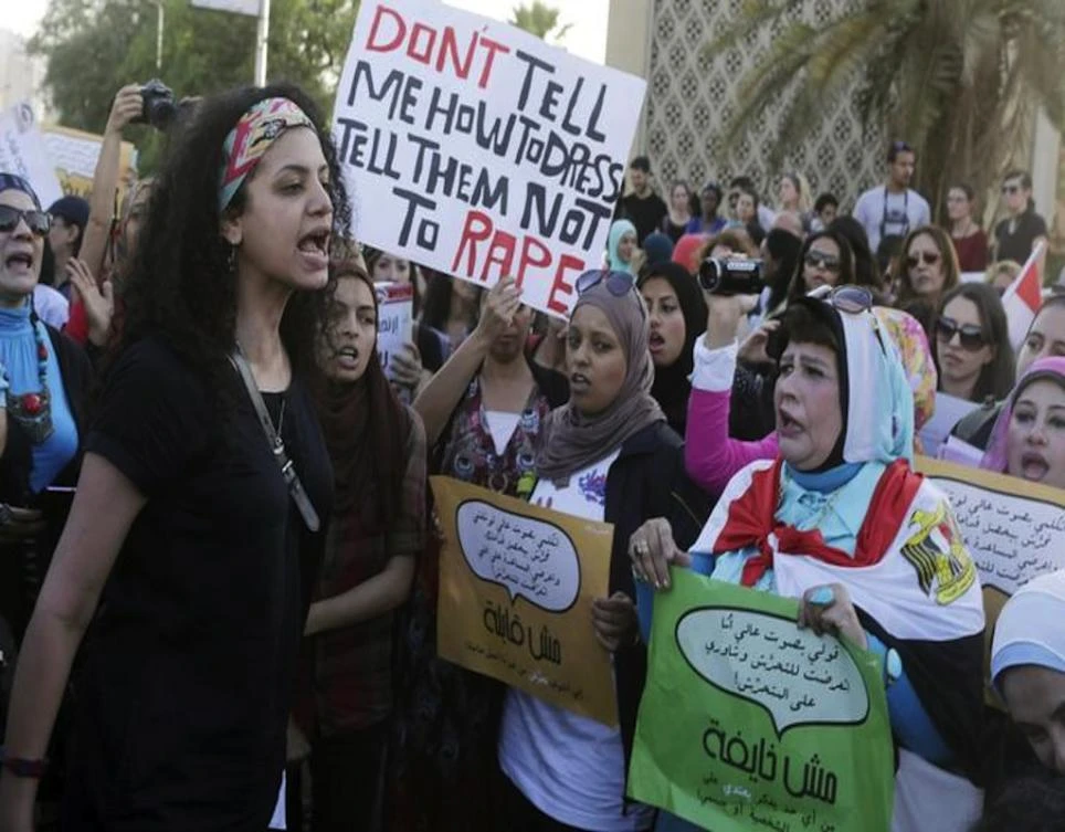Women chant slogans as they gather to protest against sexual harassment in front of the opera house in Cairo June 14, 2014. (Reuters)