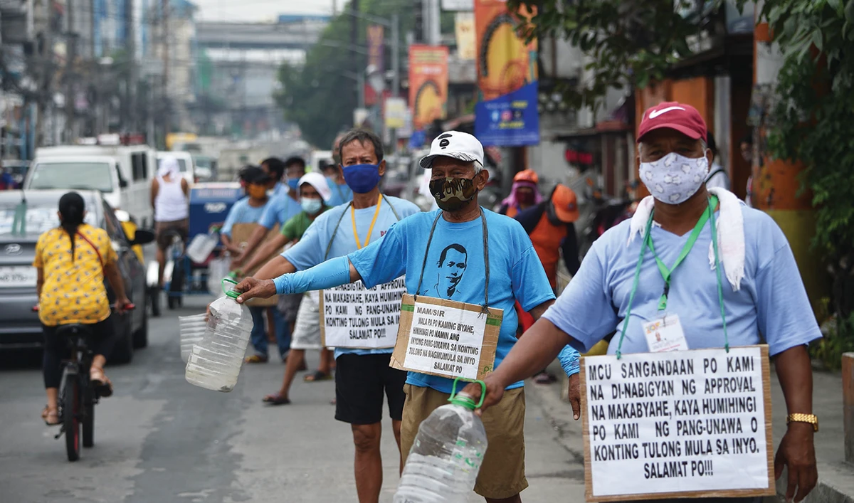 Jeepney drivers asks for the public’s help in Manila. Since March, jeepney drivers have not picked up passengers, amid the COVID-19 restrictions in Manila. (AFP)