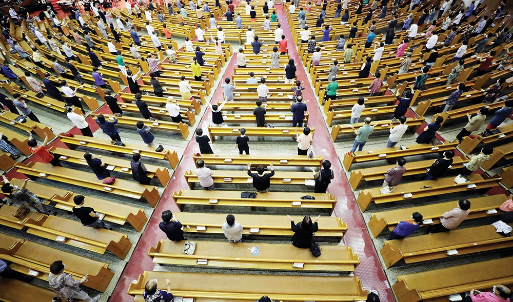 Christians observing health protocol attend a service at the Yoido Full Gospel Church in Seoul on Sunday, as South Korea has reported 279 new coronavirus cases. (AP)
