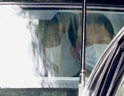 Japanese Prime Minister Shinzo Abe (L) arrives by car at Keio University Hospital in Tokyo, Japan, amid speculation about his health, in this photo taken by Kyodo, August 17, 2020. (Reuters)