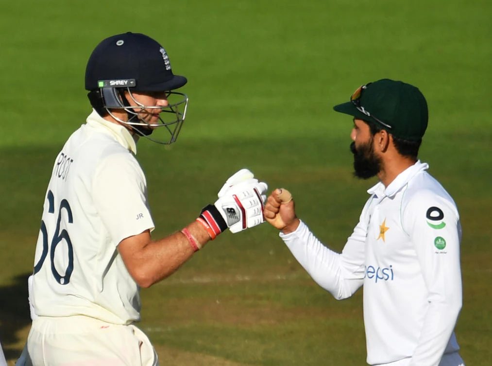 England's Joe Root and Pakistan's Fawad Alam fist pump after the test match is drawn, as play resumes behind closed doors following the outbreak of the coronavirus disease (COVID-19). (Reuters)