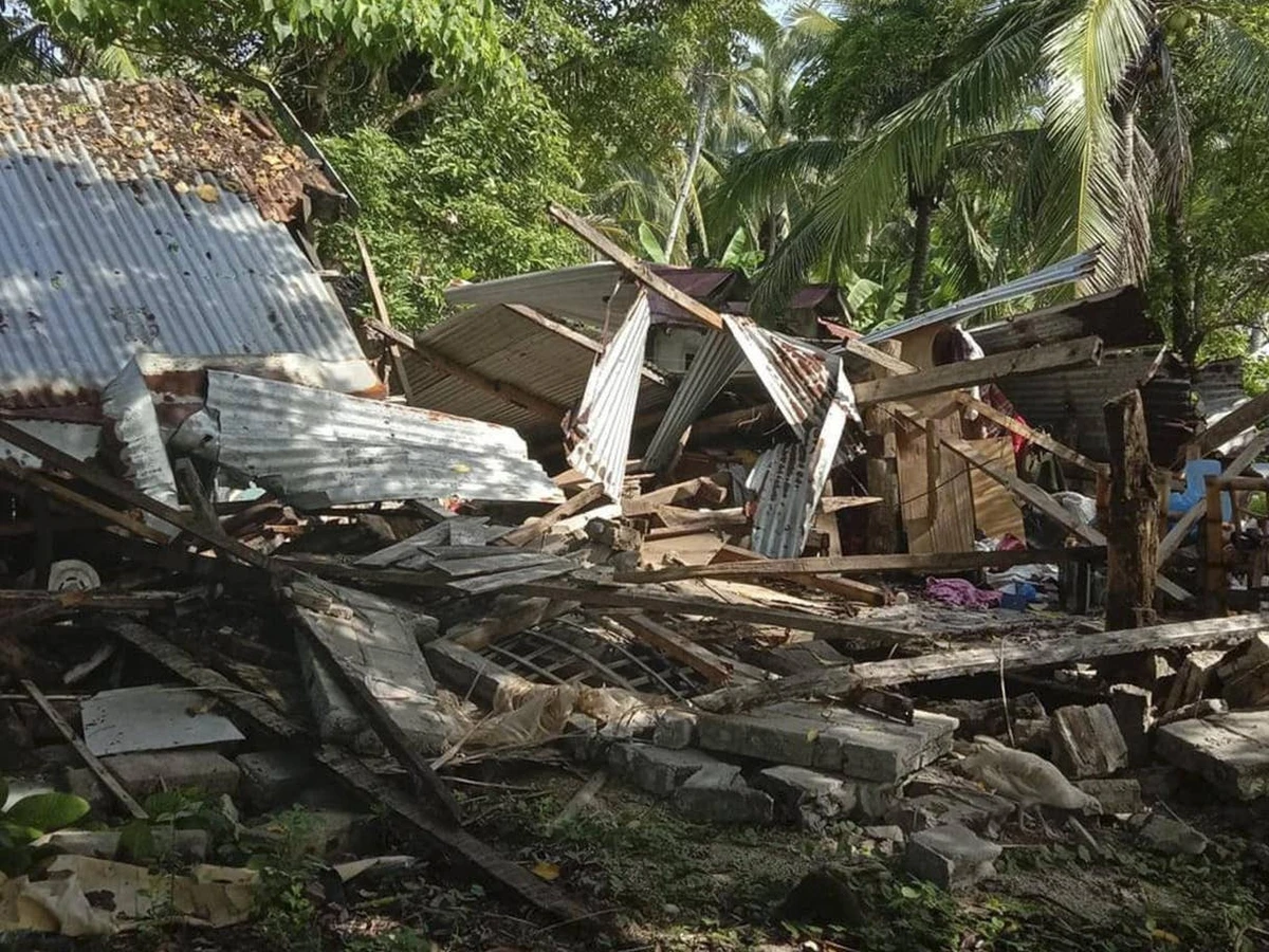 A toppled house is seen in Cataingan after a quake struck Masbate province, central Philippines. (AP)