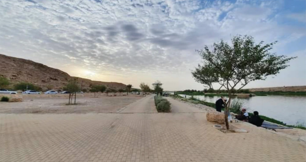 The popular beauty spot offers a desert oasis including a huge lake, waterfall feature, picnic areas and walkways dotted with palm trees. (AN photo by Rashid Hassan)
