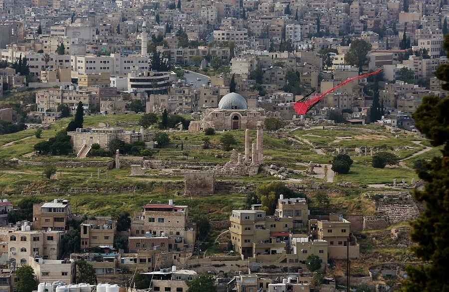 A picture taken on April 27, 2020, shows a kite flying over the Jordanian capital Amman, with the Amman Citadel in the background. (File/AFP)