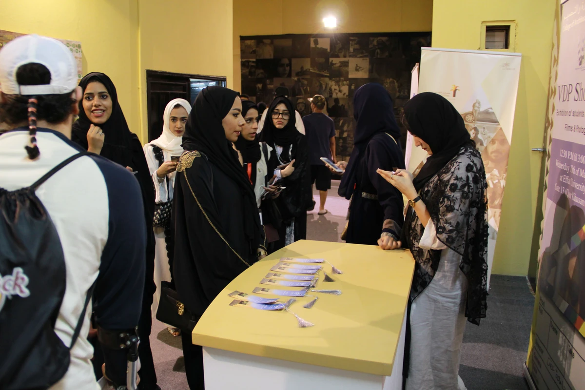 Saudi students from Effat University are seen at a booth promoting their visual and digital production program in the city of Dammam, Saudi Arabia on March 25, 2016. (AFP/File)
