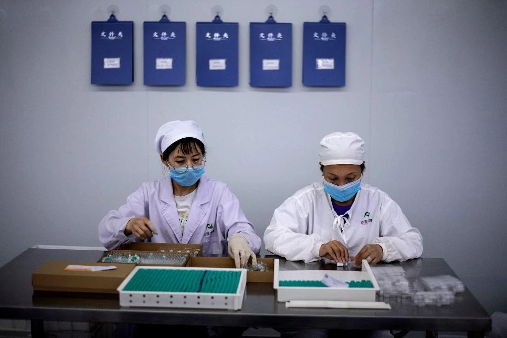 China has been giving experimental coronavirus vaccines to groups facing high infection risks since July, a health official told state media. (File/AFP)