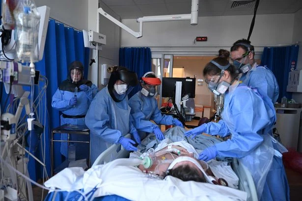 Coronavirus “will be with us forever in some form or another, and almost certainly will require repeated vaccinations,” a senior UK government scientific adviser warned on Saturday. (AFP/File Photo)