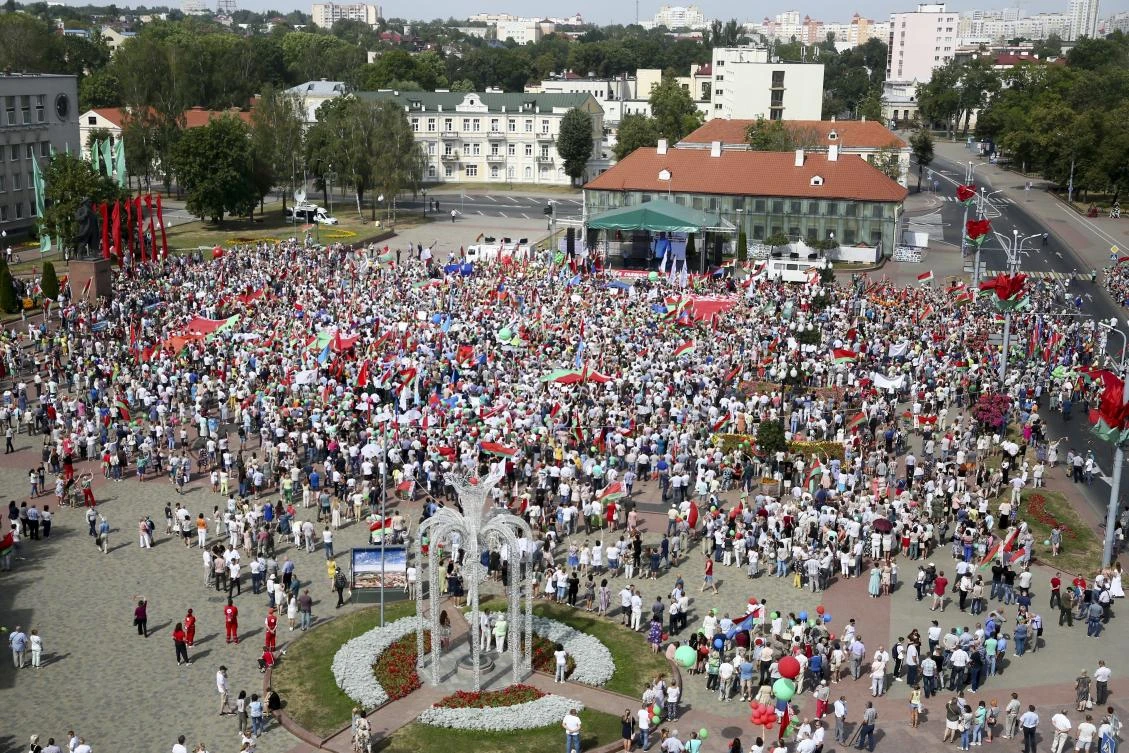 People listen to Belarusian President Alexander Lukashenko during a rally in his support in Grodno, Belarus, Saturday, Aug. 22, 2020. On Saturday, Lukashenko renewed the allegation during a visit to a military exercise in the Grodno region, near the borders of Poland and Lithuania. (AP)