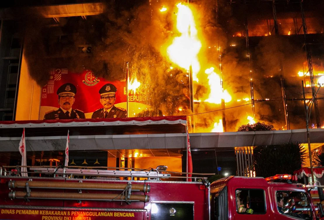 Firefighters douse a fire at the Attorney General's office in Jakarta on August 22, 2020. (AFP)