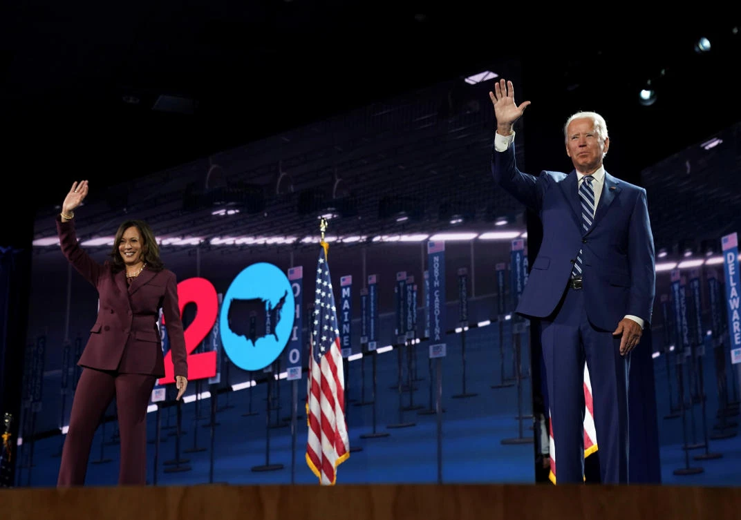 Democratic presidential candidate Joe Biden waves next to US Senator Kamala Harris after she accepted the Democratic vice presidential nomination during the largely virtual 2020 Democratic National Convention in Wilmington, Delaware, on August 19, 2020. (REUTERS/Kevin Lamarque)