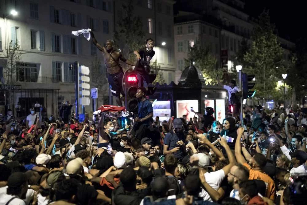 Fans of Bayern Munich celebrate in Marseille, France, on Aug. 23, 2020 after the team's Champions League victory over Paris Saint-Germain at the Luz stadium in Lisbon, Portugal. (AP Photo/Daniel Cole)