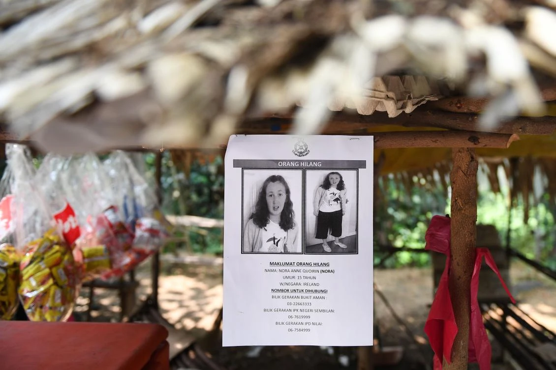 This file photo taken on August 13, 2019 shows a poster for the missing Franco-Irish teenager Nora Quoirin displayed at a stall in Seremban. (AFP)