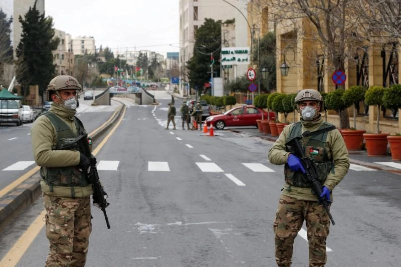 Jordanian army members stand guard at a check point after the start of a nationwide curfew, amid concerns over the coronavirus disease (COVID-19) spread, in Amman, Jordan March 21, 2020. Reuters