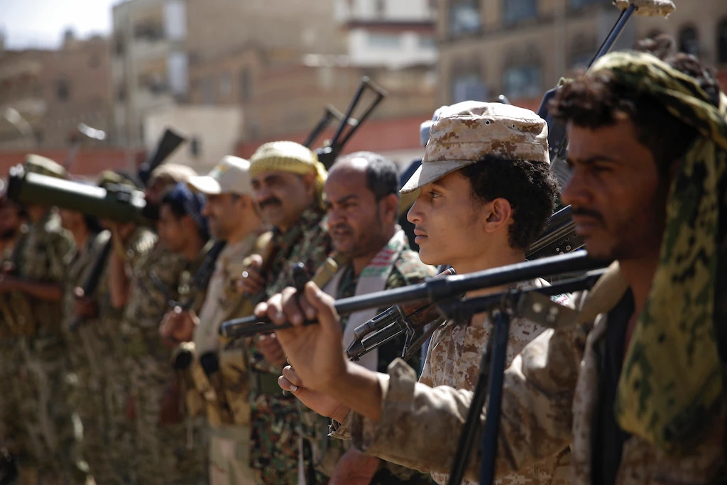 In this Feb. 20, 2020 file photo, Houthi rebel fighters display their weapons during a gathering aimed at mobilizing more fighters for the Iranian-backed Houthi movement, in Sanaa, Yemen. (AP)