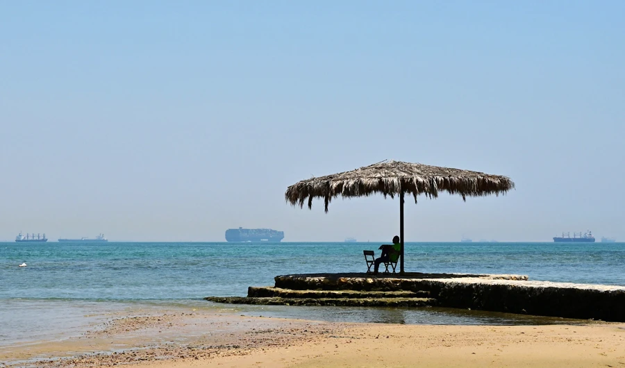 This picture taken on July 9, 2019 shows tankers and cargo ships navigating through the Great Bitter Lake in the Suez Canal southwards towards the Egyptian port city of Suez. (AFP)