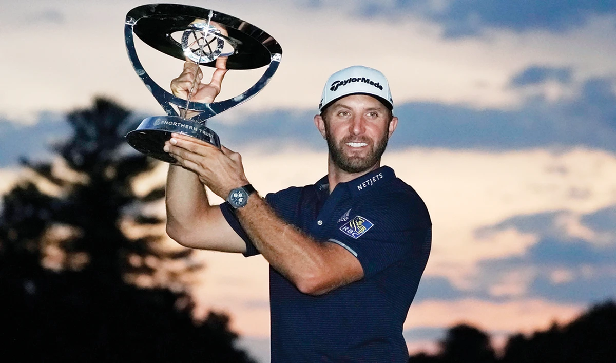 Dustin Johnson holds the trophy after winning the Northern Trust golf tournament at TPC Boston. (AP)