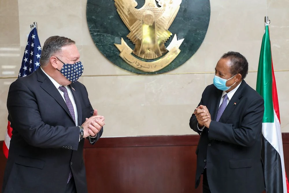 A handout picture provided by Sudan's Prime Minister's office on August 25, 2020, shows US Secretary of State Mike Pompeo (L) greeting Sudanese Prime Minister Abdalla Hamdok (R) in Khartoum. (AFP/Sudan Prime Minister Office)
