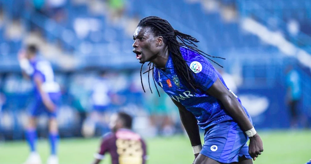 Bafétimbi Gomis celebrates after finding the net with a calm left-foot finish. (SPA)