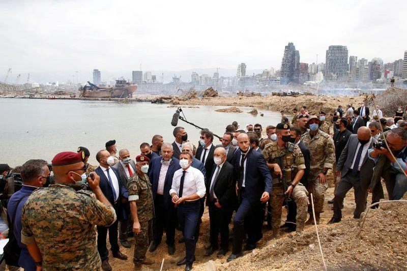 French President Emmanuel Macron visits the devastated site of the explosion at the port of Beirut, Lebanon August 6, 2020.(Reuters)