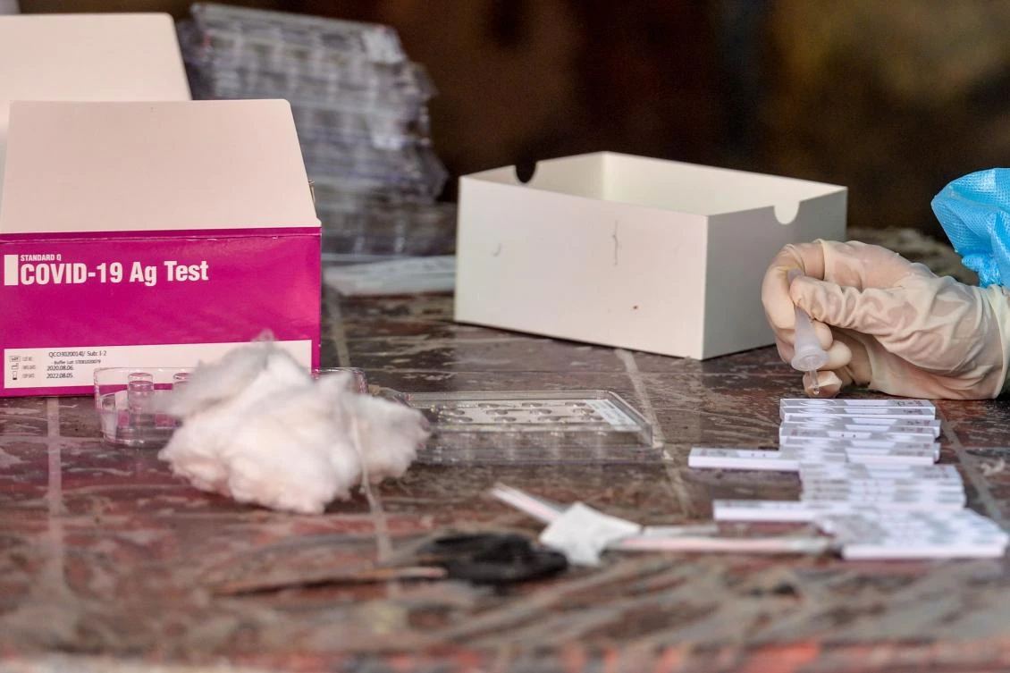 A health worker examines swab samples for Rapid Antigen Test (RAT) for the COVID-19 coronavirus at a testing centre in Siliguri, India on August 26, 2020. (AFP)