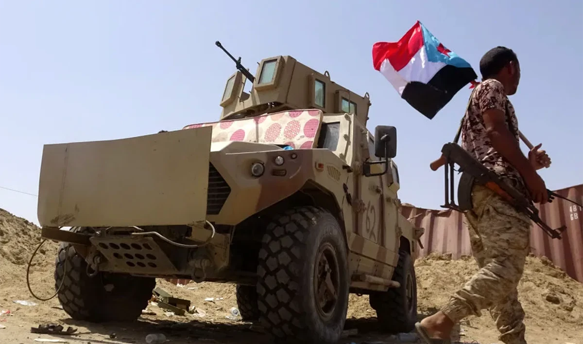 A fighter loyal to Yemen's separatist Southern Transitional Council (STC) holds the separatist flag in the southern Abyan province. (AFP)