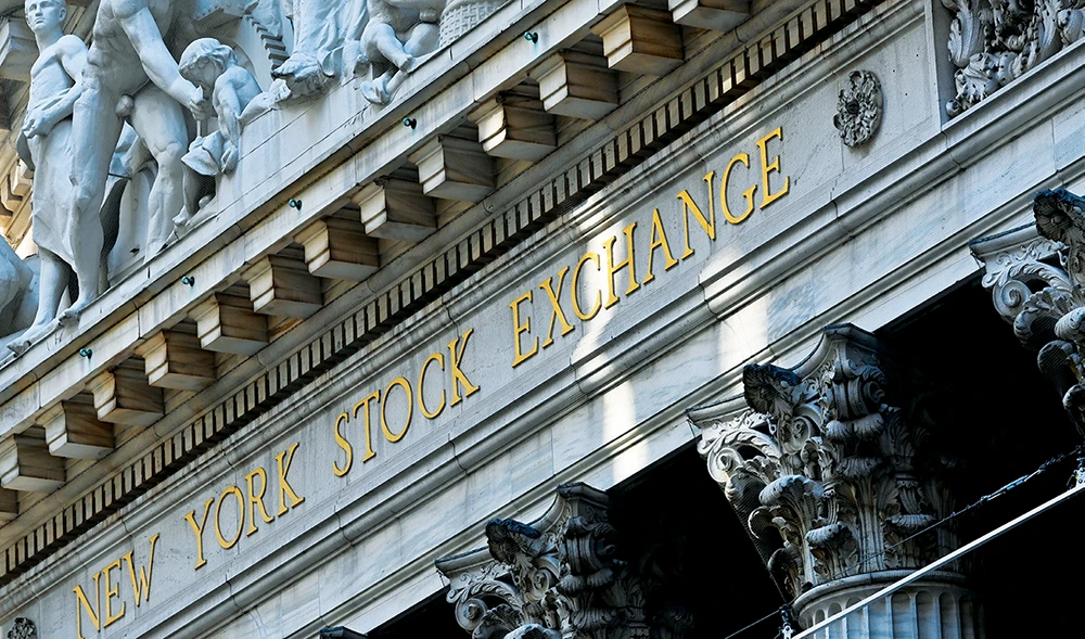 Despite a global economic slowdown, some banks are attempting to be measured in their cost-cutting exercises, with some even planning to pay bonuses. (AFP)