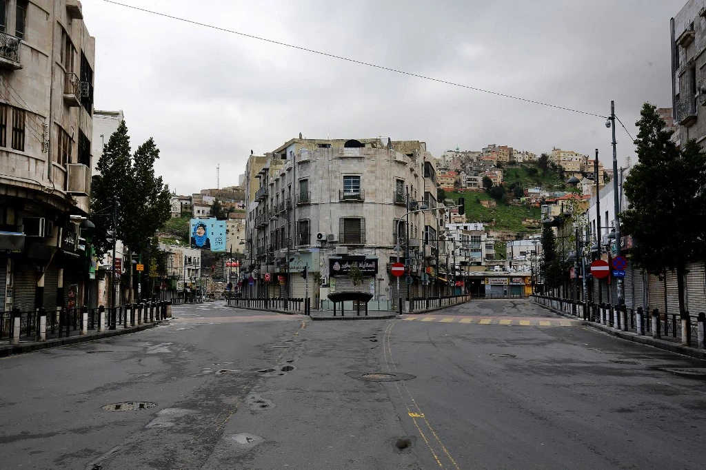 Above, the Jordanian capital of Amman is deserted during a nationawide curfew imposed by the authorities in order to control the spread of coronavirus in this March 21, 2020 file photo. (AFP)
