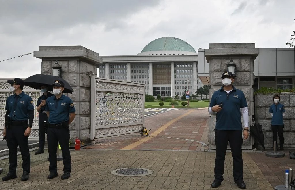 South Korea’s parliament, above, was shut down on August 27 and a group of lawmakers were in self-quarantine as the country recorded more than 400 new coronavirus infections. (AFP)