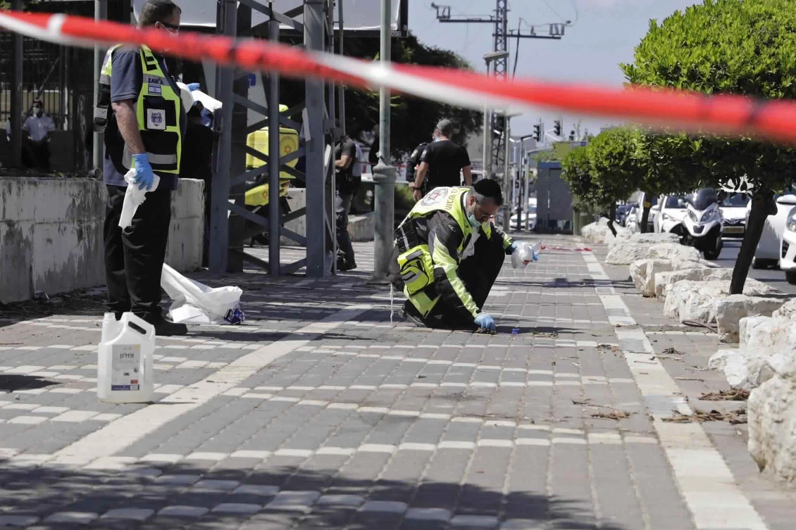 Israeli rescue workers clean the scene of a stabbing attack in the Israeli central city of Petah Tikvah, Wednesday, Aug. 26, 2020. (AP)