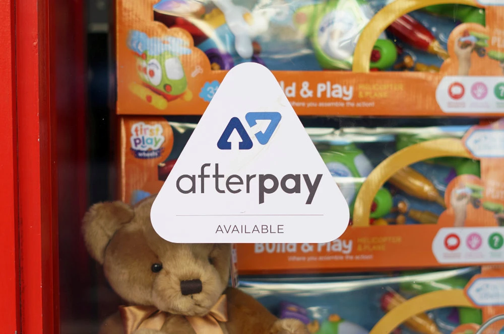 A logo for the company Afterpay is seen in a store window in Sydney, Australia. (REUTERS/Stephen Coates/File Photo)