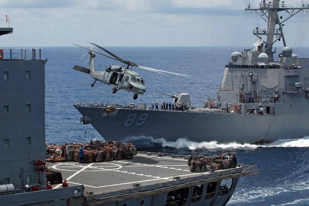 The guided-missile destroyer USS Mustin (DDG 89), background, with the USS Essex, foreground, during relief operations in Myanmar in 2008. (AFP file photo)