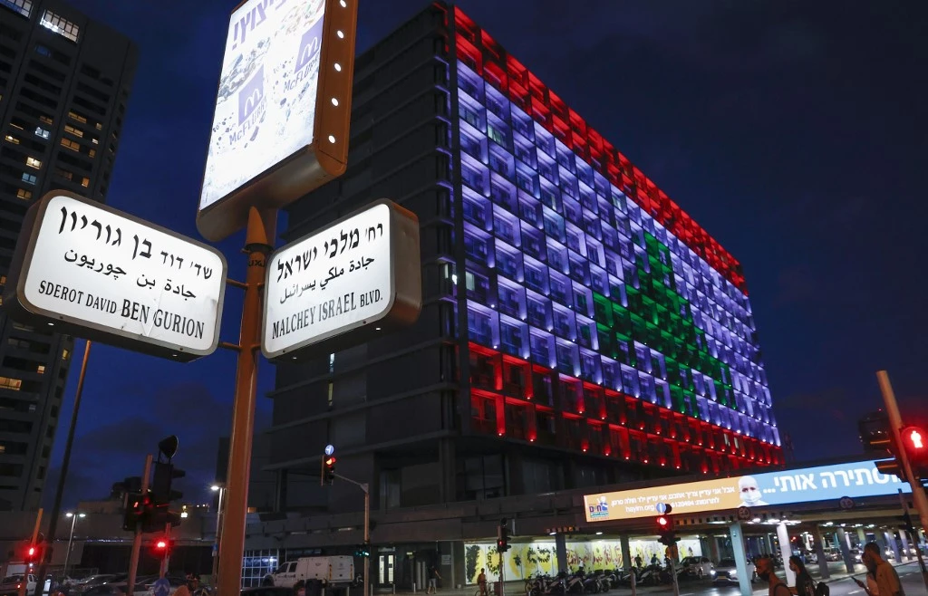 Above, the Tel Aviv city hall is lit up in the colors of the Lebanese national flag in solidarity, on August 5, 2020, a day after a devastating blast at the port of Beirut. (AFP)