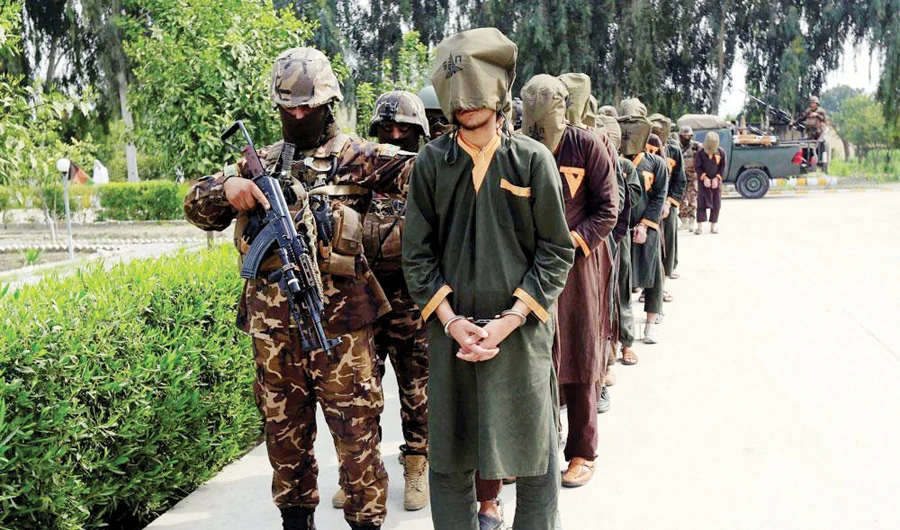 Arrested insurgents are escorted by Afghan security forces during a presentation to the media in Jalalabad, Afghanistan. (Reuters/File)