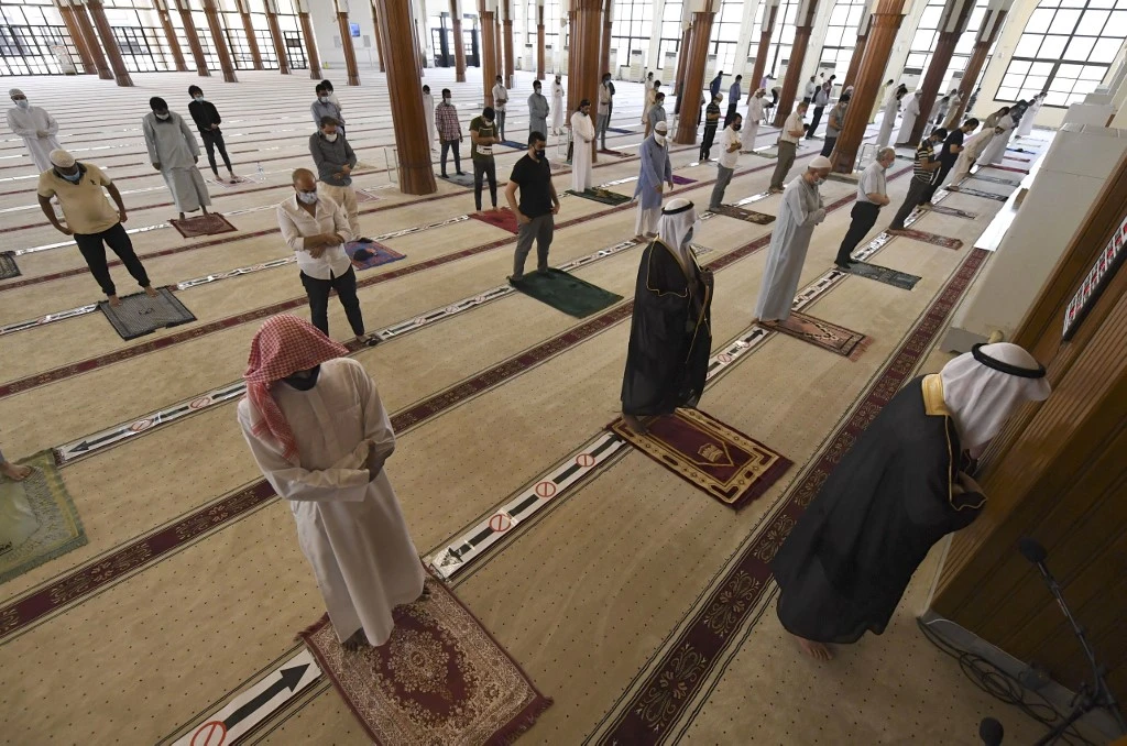 Worshippers keeping a safe distance from one another perform prayers at a mosque in the emirate of Sharjah. (File/AFP)