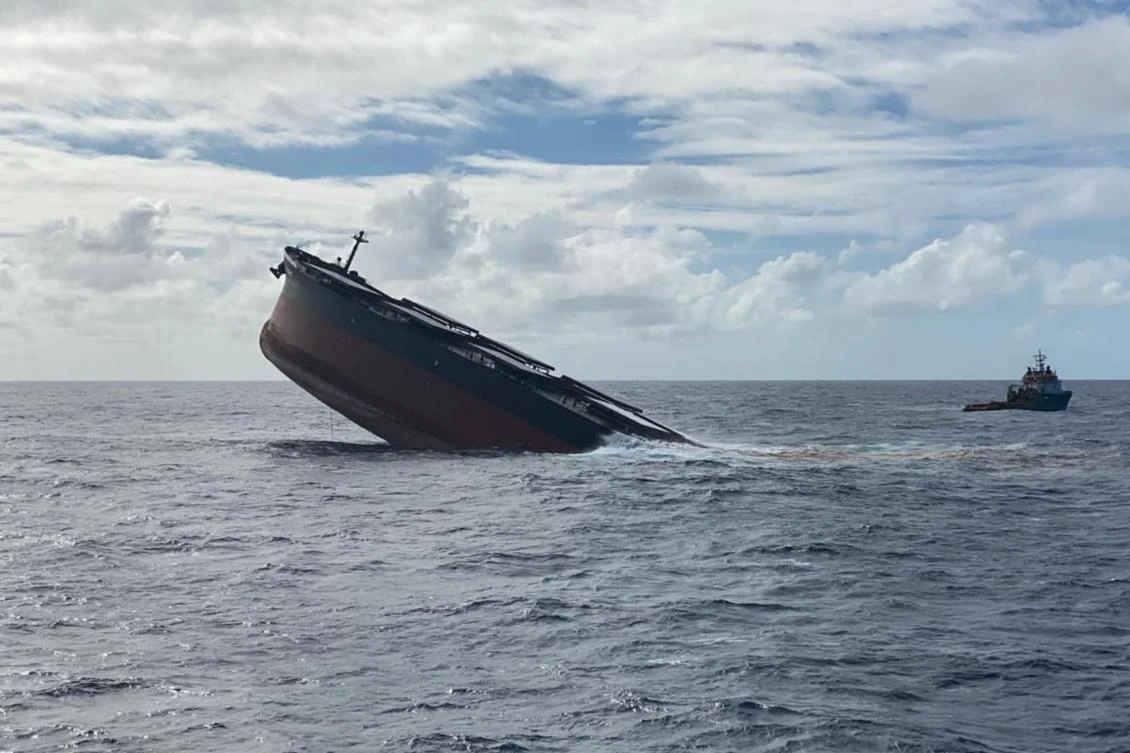 This handout picture taken on August 24, 2020, by the Mauritius Police Press Office shows the broken stem of the MV Wakashio, a Japanese-owned ship which ran aground causing a devastating oil spill, sinking in the open water near Mauritius. The MV Wakashio ran aground on a coral reef off the Indian Ocean island on July 25, 2020. (AFP)