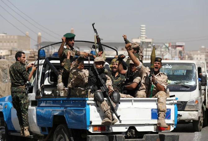Houthi troops ride on the back of a police patrol truck after participating in a Houthi gathering in Sanaa, Yemen Feb. 19, 2020. (Reuters)