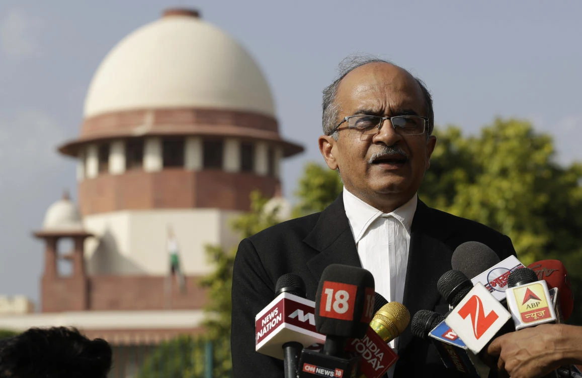 In this Monday, Sept. 4, 2017, file photo, Indian lawyer and social activist Prashant Bhushan speaks to the journalists outside the Supreme Court in New Delhi, India. (AP)