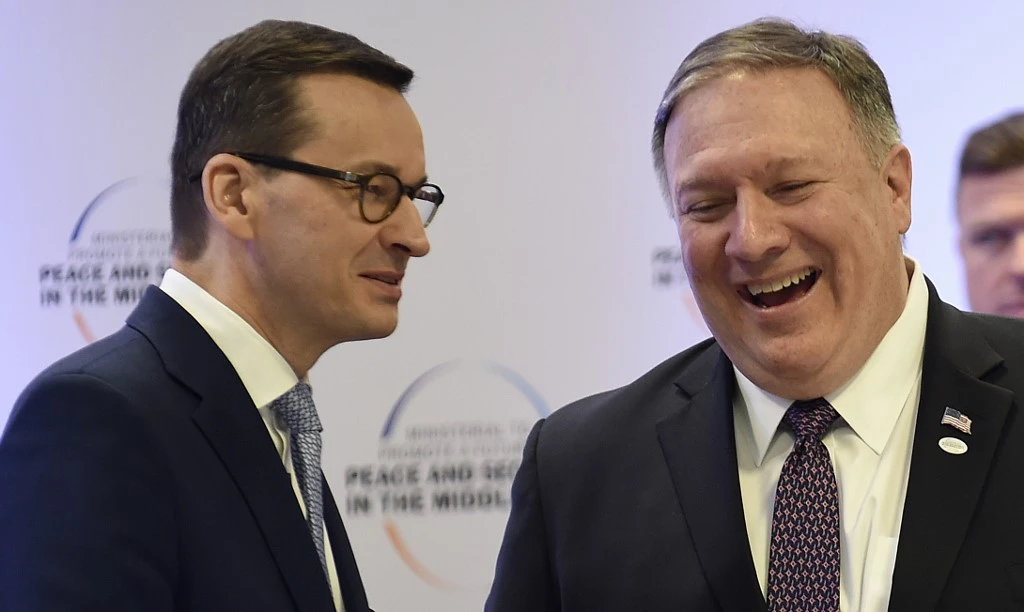 Poland's PM Mateusz Morawiecki and US Secretary of State Mike Pompeo share a smile as they attend a conference in Warsaw. (File/AFP)