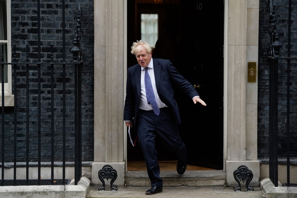UK prime minister Boris Johnson has built a reputation for leading a government that is distinguishing itself by its constant U-turns. (AFP)